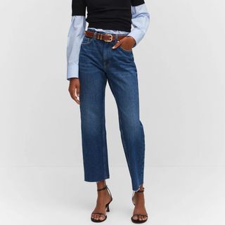 Mango straight jeans on model paired with blue shirt and black jumper 
