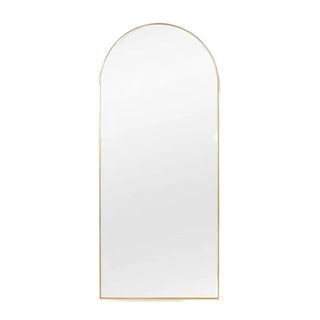 A gold arched mirror