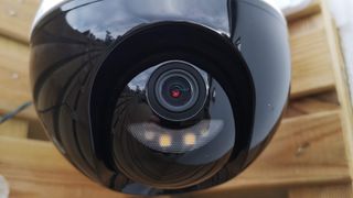 A close up the camera lens on the Ezviz C8C