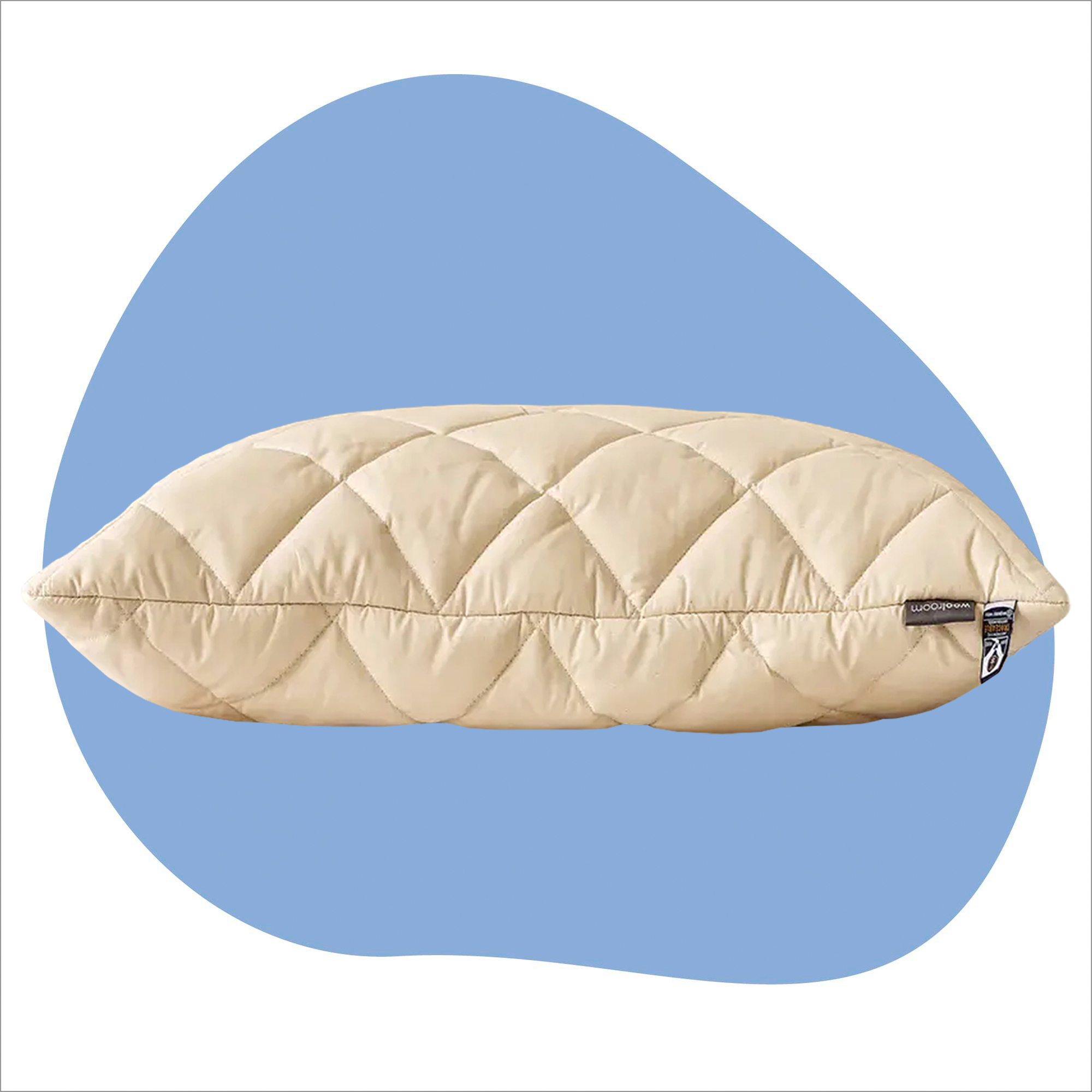 The Woolroom Natural Latex Washable Wool Pillow on a blue background