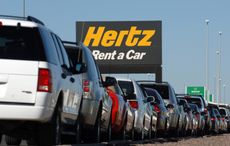 A view of a Hertz Rent-a-Car parking lot. 