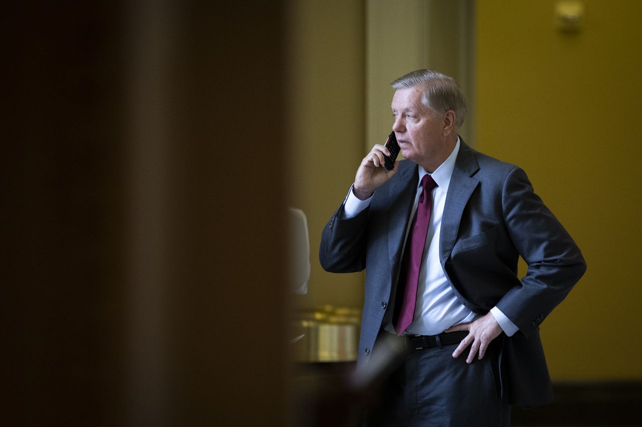 Lindsey Graham on his phone