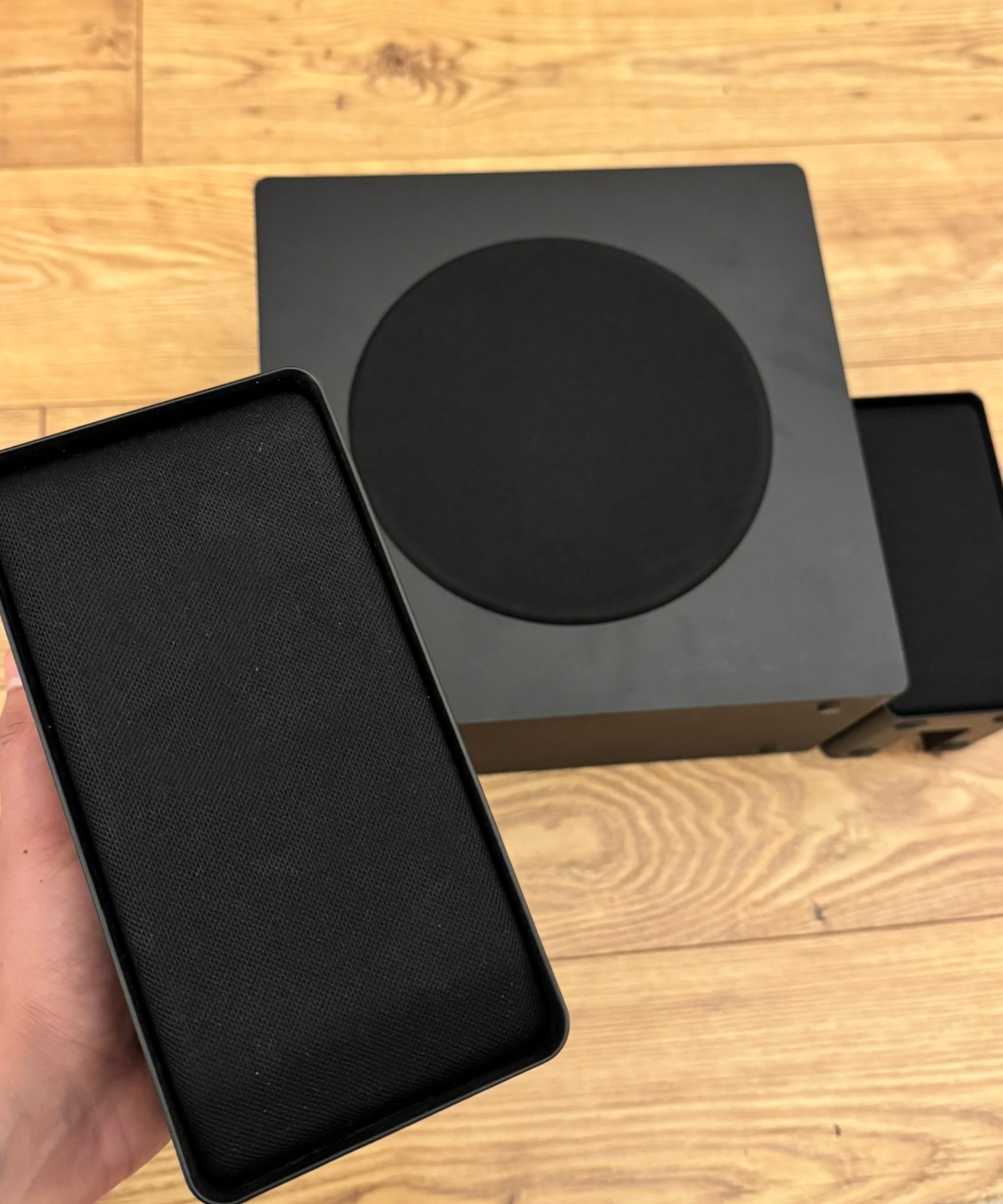 Hisense AX5140Q rear speakers and subwoofer on wooden floor.