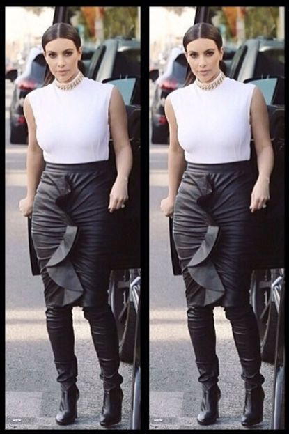 Kim Kardashian wears leather leggings boots.