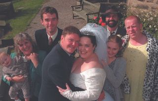 Mandy and Paddy on their wedding day with all their family around them.
