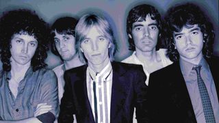 A posed studio portrait of Tom Petty And The Heartbreakers in 1977