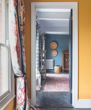 Yellow walls, blue room, multi coloured curtains