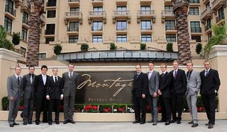 Riders on Fly V Australia pose with Team Owner Chris White (fifth from left) outside the Montage hotel.