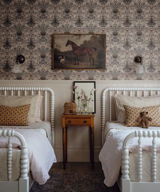 image of bedroom with twin beds and wallpaper