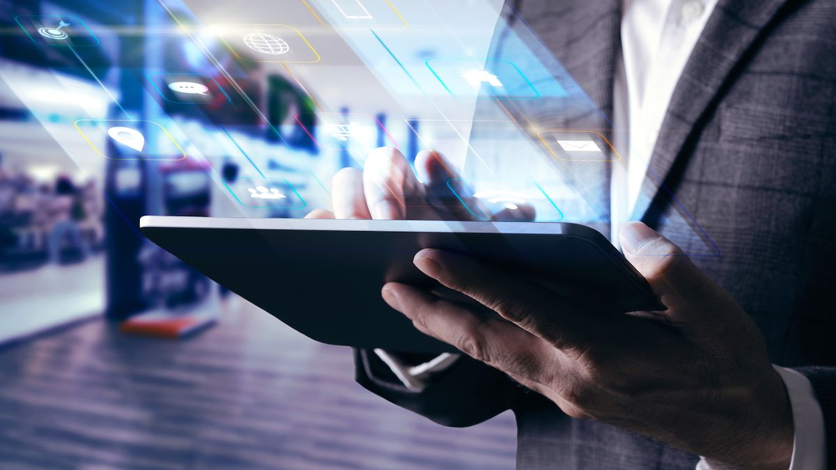 Businessman operating a tablet