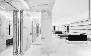 Interior of Saint Laurent store in Boston. Black sofas, marble pillars, marble walls and floor, with chrome shelving