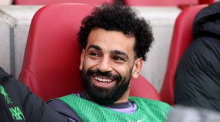 Mohamed Salah on the bench during Liverpool's game against Brentford in February 2024.