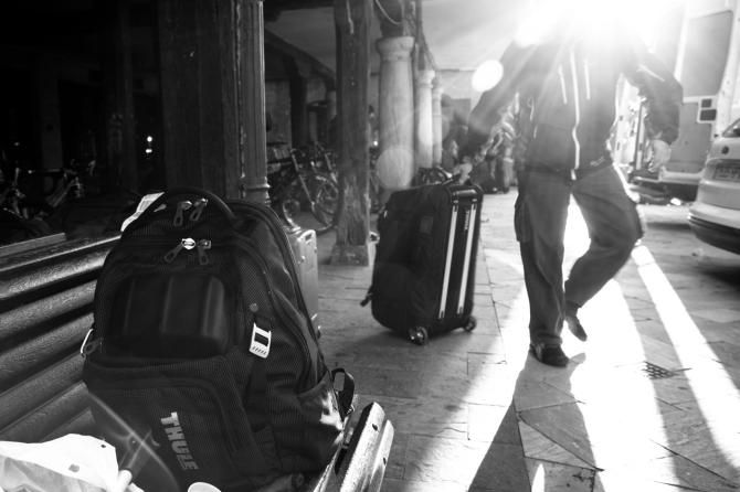 Guest mechanic Esteban Pena hauls luggage into the team van during the Vuelta a Castilla y Leon
