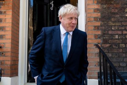 Boris Johnson leaves his headquarters