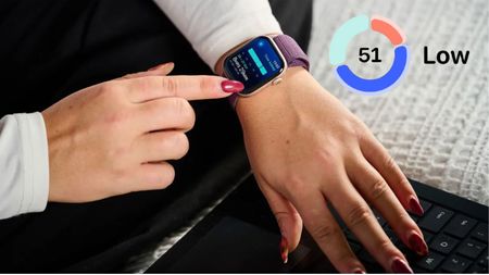 A woman checking Apple Sleep Score on Apple Watch 10 with purple strap on left wrist 