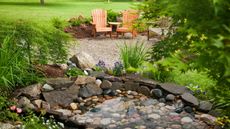 garden pond ideas: rocky pond with seating nearby