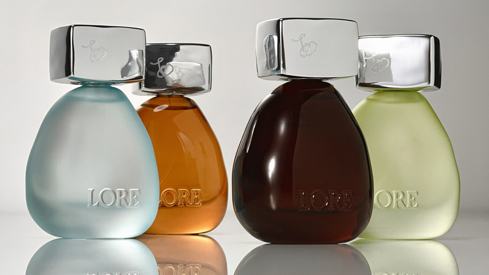 lore perfume bottles on gradient background 
