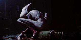 a neomorph eating a victim in Covenant