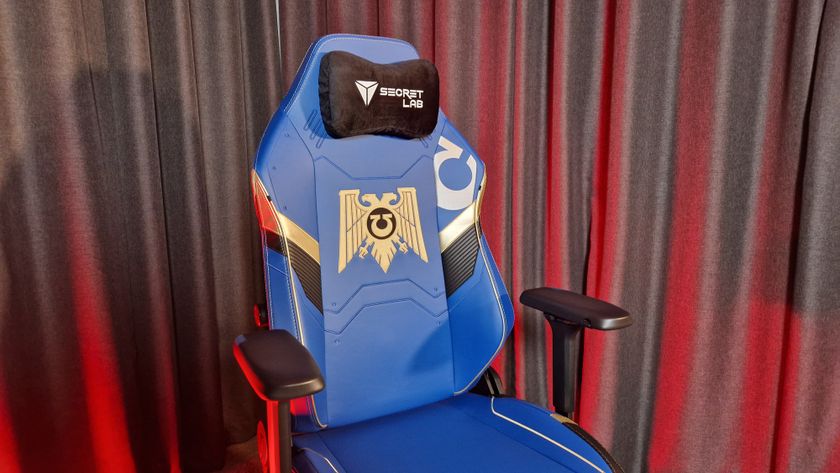 A shot of the Secretlab Titan Evo Warhammer 40,000 Ultramarine edition in front of a gray curtain