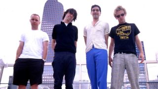 Foo Fighters standing on a rooftop, 1998