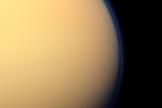 This day-side photo of Titan taken by the Cassini spacecraft shows a buildup of haze over the Saturn moon's south pole (bottom). Cassini has found a build up of haze over the south pole (bottom). New results from Cassini's infrared spectrometer show that air is now sinking at the south pole, leading to increased temperatures at high altitude and a large enrichment in trace gases. Image released Nov. 28, 2012.