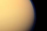 This day-side photo of Titan taken by the Cassini spacecraft shows a buildup of haze over the Saturn moon's south pole (bottom). Cassini has found a build up of haze over the south pole (bottom). New results from Cassini's infrared spectrometer show that air is now sinking at the south pole, leading to increased temperatures at high altitude and a large enrichment in trace gases. Image released Nov. 28, 2012.