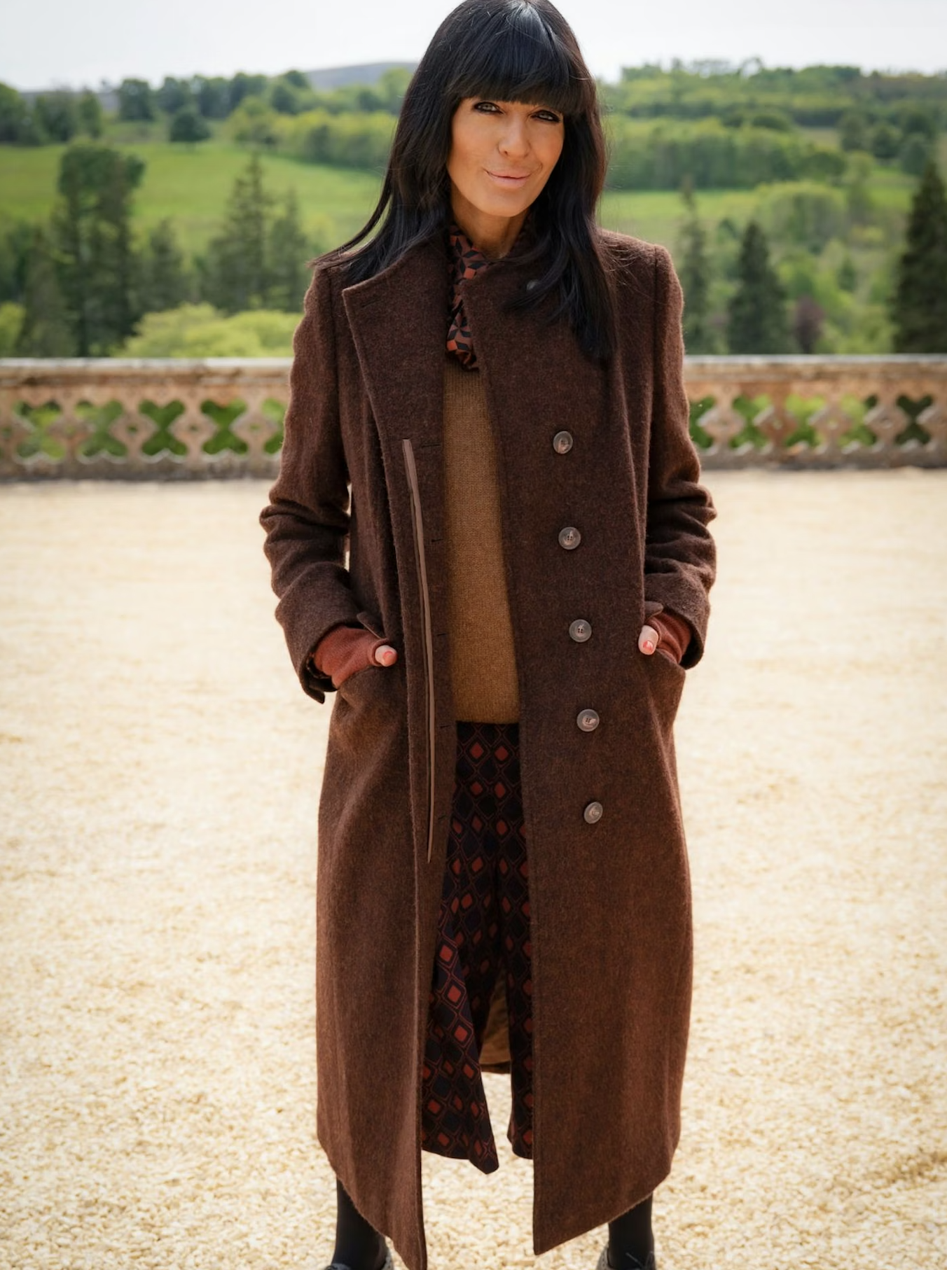 Claudia Winkleman wearing brown coat