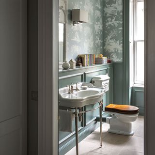 bathroom with grey designed wall commode and wash basin