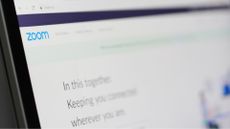 Zoom website displayed on monitor