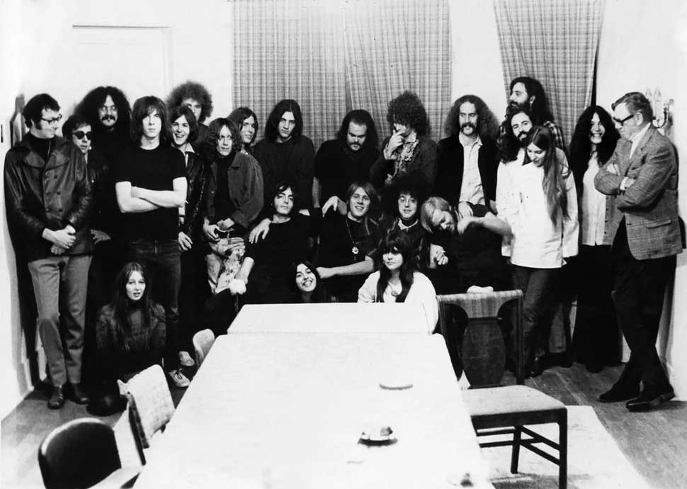 October 1968: Rock groups MC5 and The Stooges pose for a photo with friends and record executives as they both sign contracts with Elektra Records