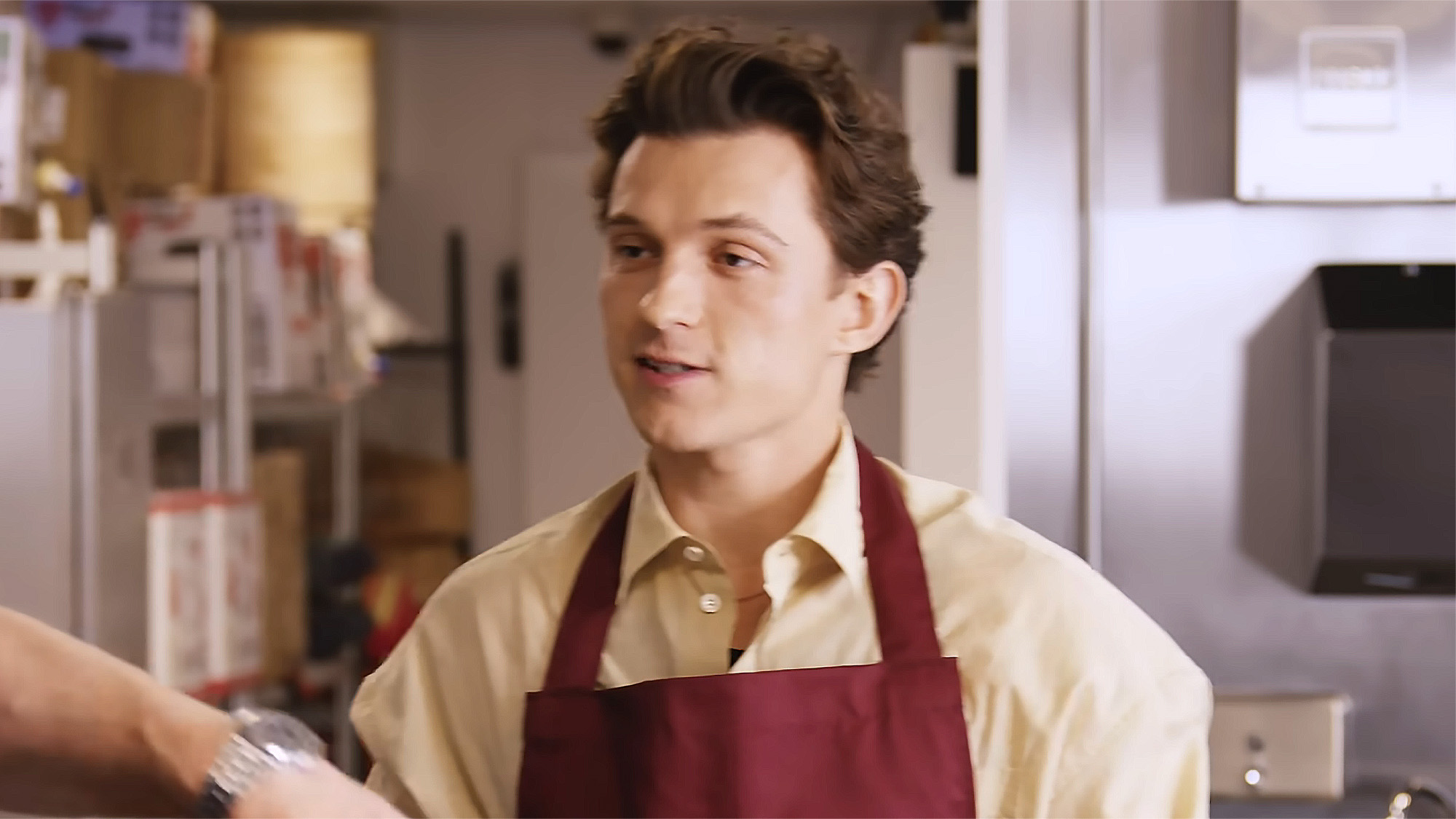 Tom Holland cooking in a youtube video with Chef Gordon Ramsay.