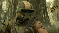 A close up of a Helldiver wearing a green helmet against a jungle background