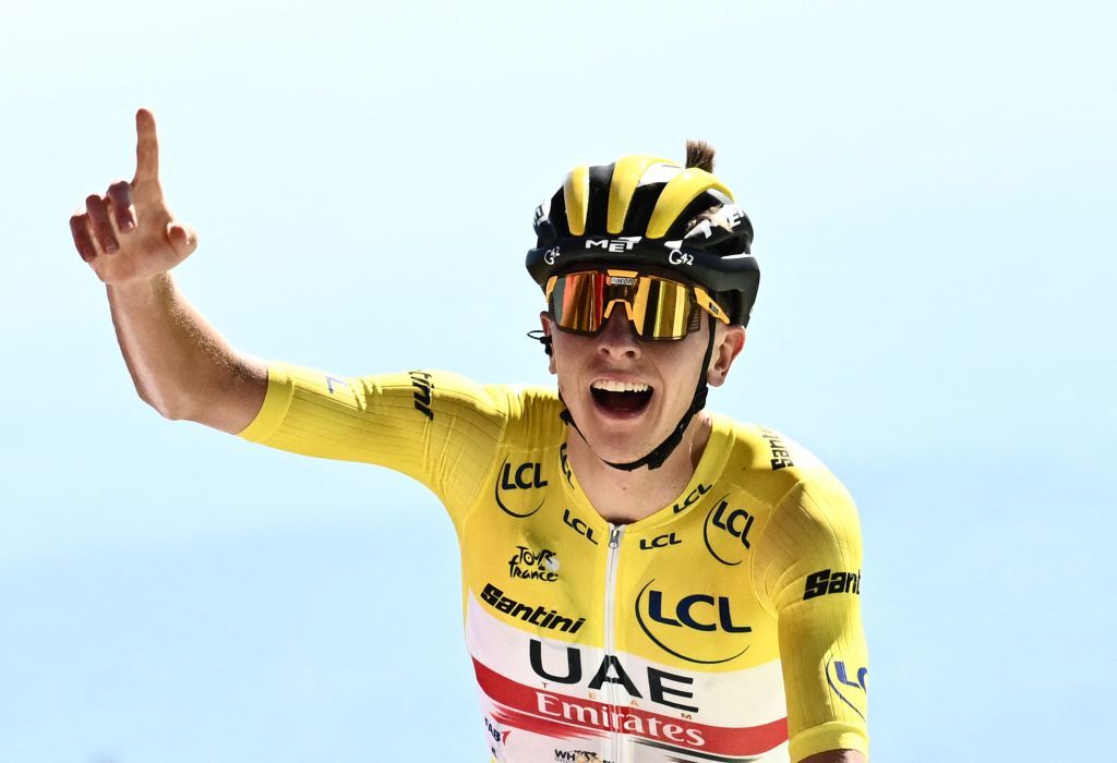 TOPSHOT UAE Team Emirates teams Slovenian rider Tadej Pogacar wearing the overall leaders yellow jersey celebrates as he cycles to win the 7th stage of the 109th edition of the Tour de France cycling race 1763 km between Tomblaine and La Super Planche des Belles Filles in eastern France on July 8 2022 Photo by Marco BERTORELLO AFP Photo by MARCO BERTORELLOAFP via Getty Images