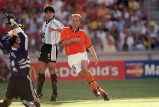 Dennis Bergkamp scores a last-minute winning goal for the Netherlands against Argentina in the quarter-final of the 1998 World Cup in France