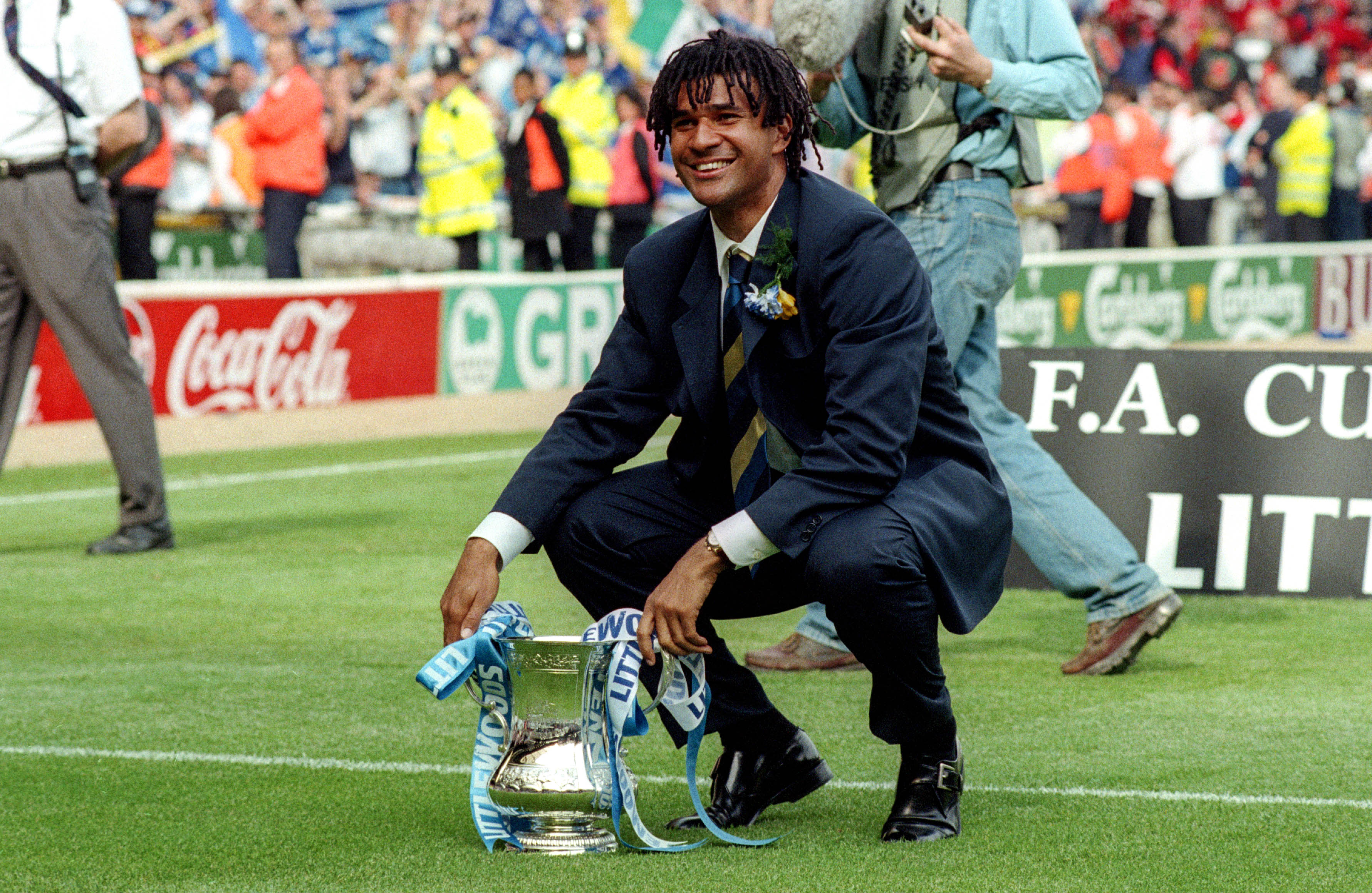 Ruud Gullit poses with the FA Cup after Chelsea's win over Middlesbrough in the final in May 1997.