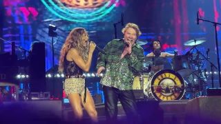 Carrie Underwood and Axl Rose onstage