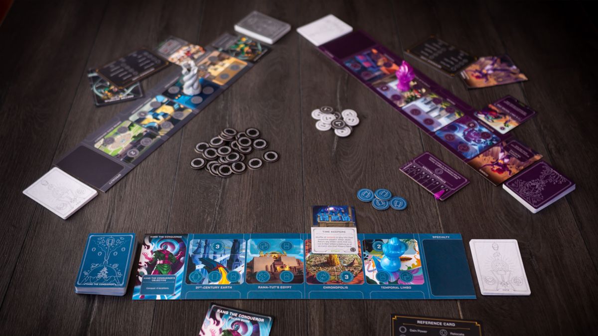 Marvel Villainous: Twisted Ambitions boards, tokens, and cards on a wooden table