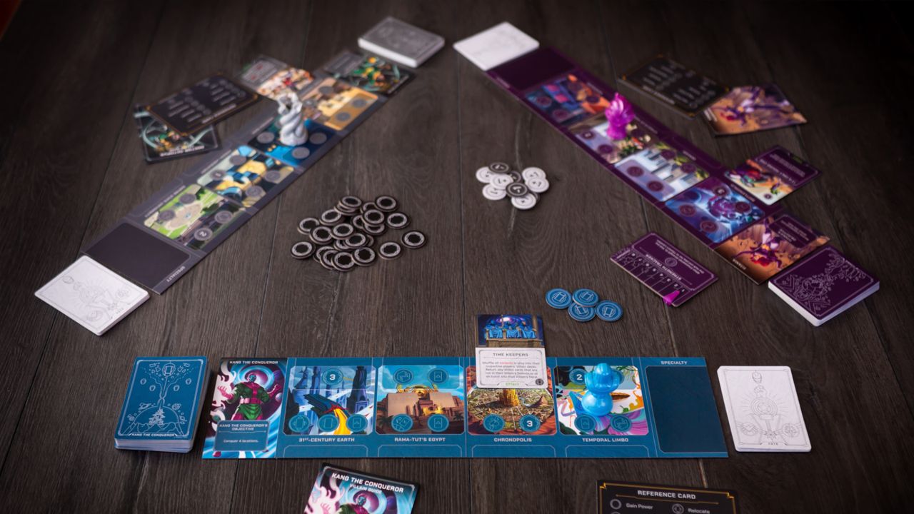 Marvel Villainous: Twisted Ambitions boards, tokens, and cards on a wooden table