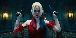 Margot Robbie as Harley Quinn holding guns in The Suicide Squad