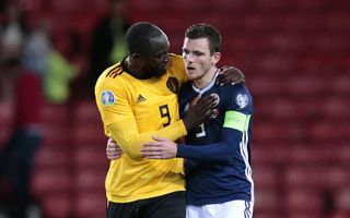 Romelu Lukaku, left, consoles Andy Robertson after the game