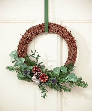 Twiggy wreath with foliage and pine cones