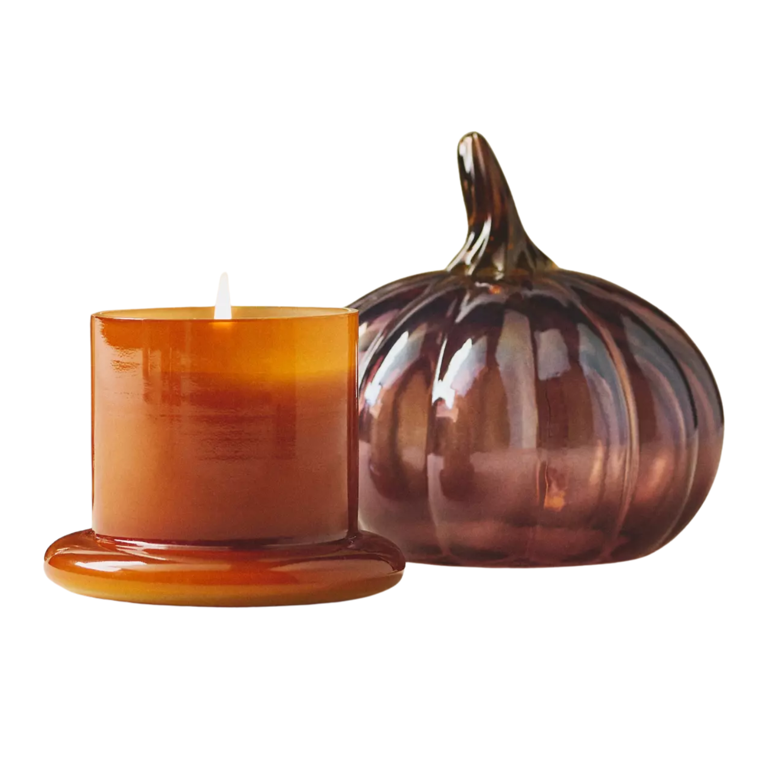 A purple glass pumpkin candle with an orange base
