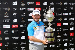 Louis Oosthuizen holds the South African Open trophy