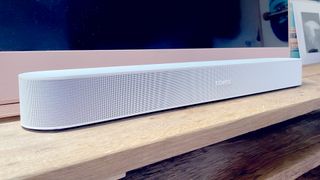 The Sonos Beam in front of a Sky Glass TV