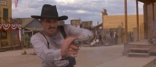 Doc Holliday (played by the immortal Val Kilmer) unloads on the Clanton Gang during the O.K. Corral gunfight, which is the best part of