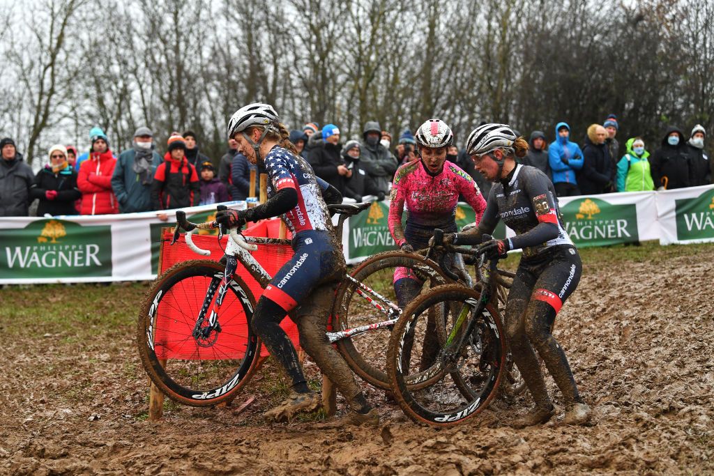BESANCON FRANCE NOVEMBER 28 LR Clara Honsinger of The United States and Team CannondaleCyclocrossworld Silvia Persico of Italy and Team Valcar Travel Service and Katie Clouse of The United States and Team CannondaleCyclocrossworld compete on a muddy sector during the 6th Besanon UCI CycloCross Worldcup 2021 Womens Elite CXWorldCup UCIcyclocrossWC on November 28 2021 in Besancon France Photo by Luc ClaessenGetty Images