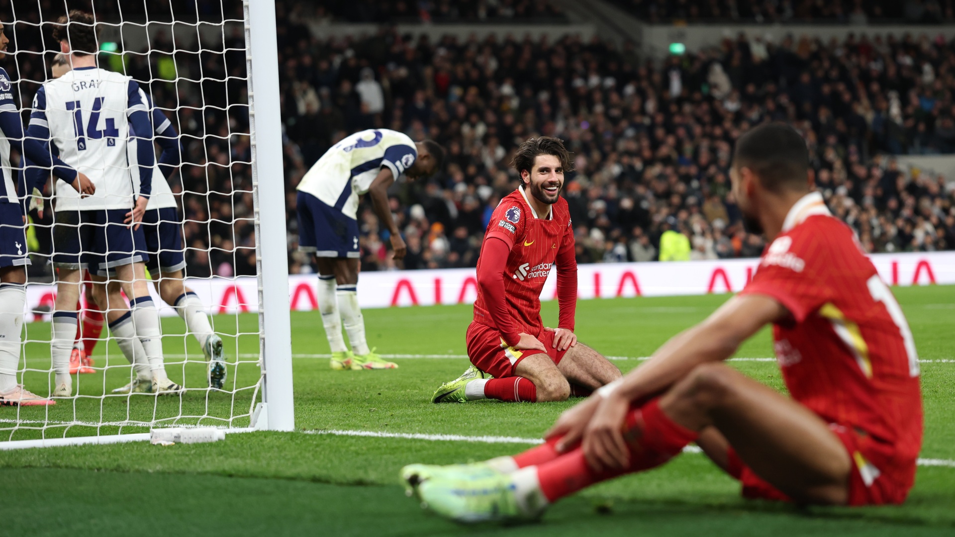 Dominik Szoboszlai laughing with Cody Gakpo during a recent Tottenham vs Liverpool game