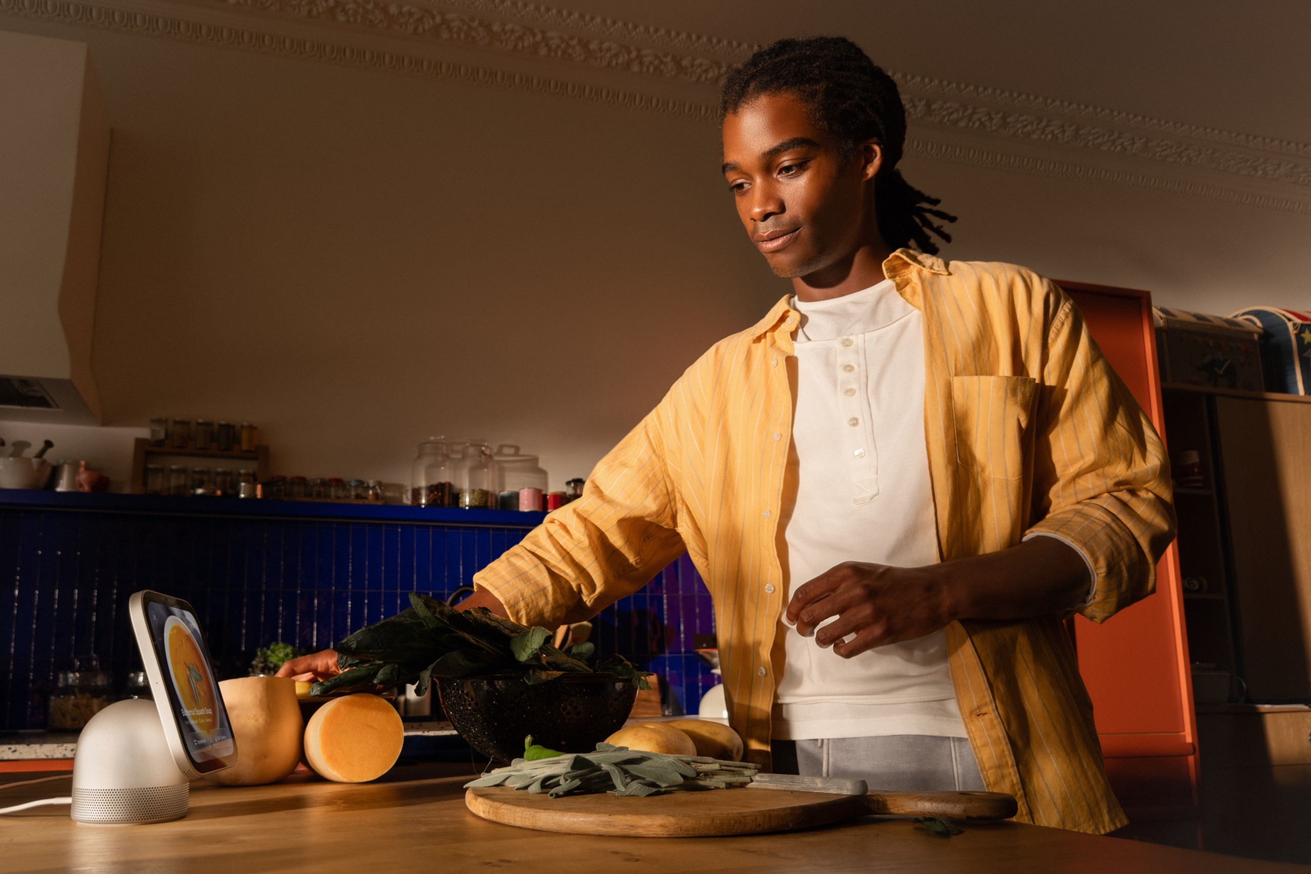 Apple homeview on a side with a man cooking in a kitchen