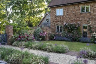 gravel garden bath with brick edging and planting