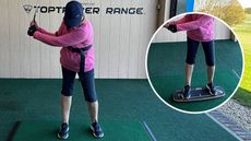 Female golfer using training aids